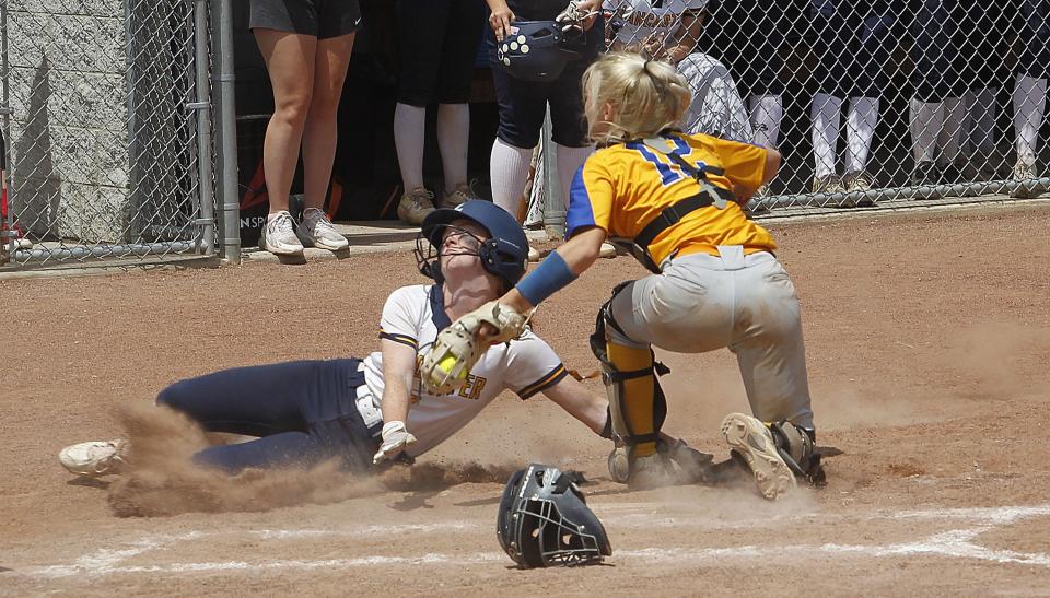 Lancaster's Zhari Hill is tagged out by Gahanna's Nicole Waters during a Division I regional semifinal May 25 at Centerburg.