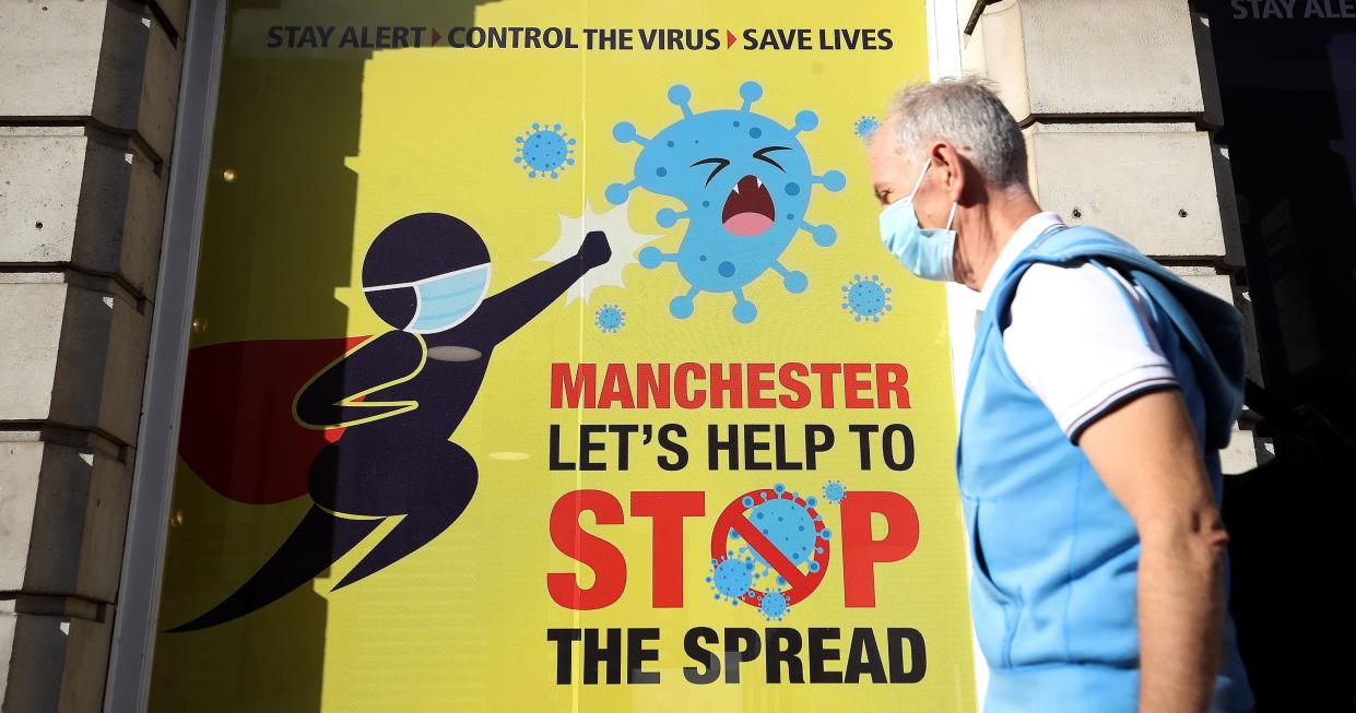 Posters urge residents of Manchester to observe coronavirus restrictions (PA)