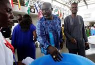 George Weah, former soccer player and presidential candidate of Congress for Democratic Change (CDC), is pictured at a church in Monrovia, Liberia October 8, 2017. Picture taken October 8, 2017. REUTERS/Thierry Gouegnon