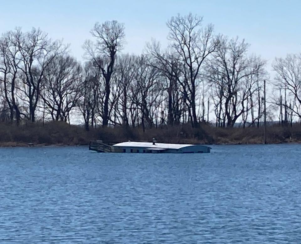 A houseboat on Horseshoe Pond, on the eastern tip of Presque Isle State Park, has sunk, as shown here on April 1, 2024.