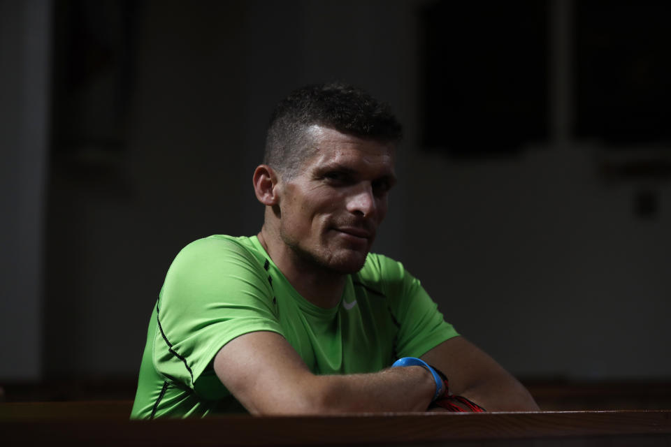 Roman Catholic priest Michal Lajcha sits in a church in Klak, Slovakia, Monday, Sept. 17, 2018. Lajcha is challenging the Roman Catholic Church’s celibacy rules in a rare instance of dissent in the conservative religious stronghold in central and eastern Europe. (AP Photo/Petr David Josek)