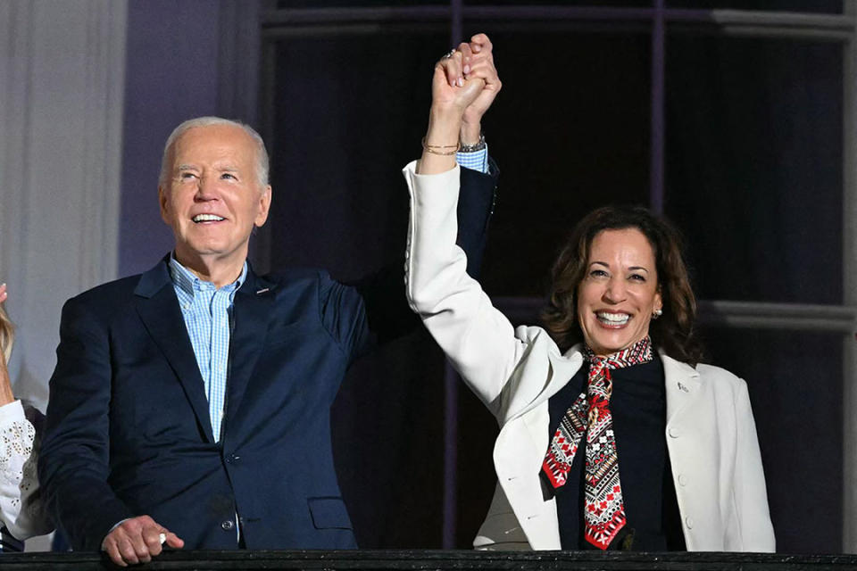 President Joe Biden and Vice President Kamala Harris walk on stage during a 4th of July event on the South Lawn of the White House 