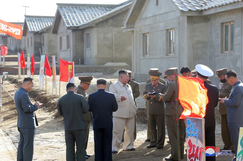 North Korean leader Kim Jong Un inspects a damage recovery site affected by heavy rains and winds caused by recent typhoons, in Geomdeok district, South Hamgyong