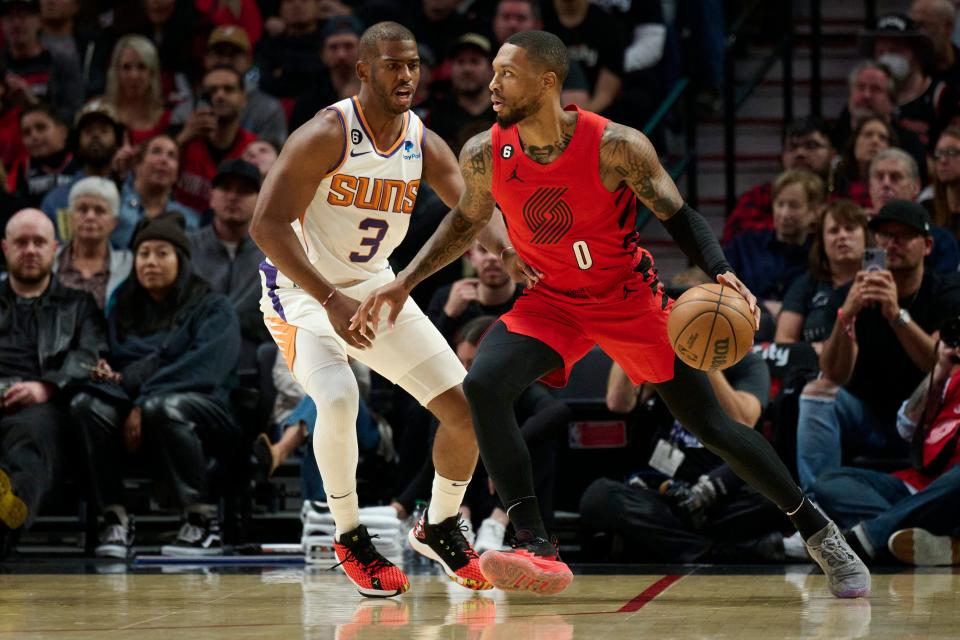 Phoenix Suns guard Chris Paul (3) guards Portland Trail Blazers guard Damian Lillard (0) during the first half at Moda Center in Portland on Oct. 21, 2022.