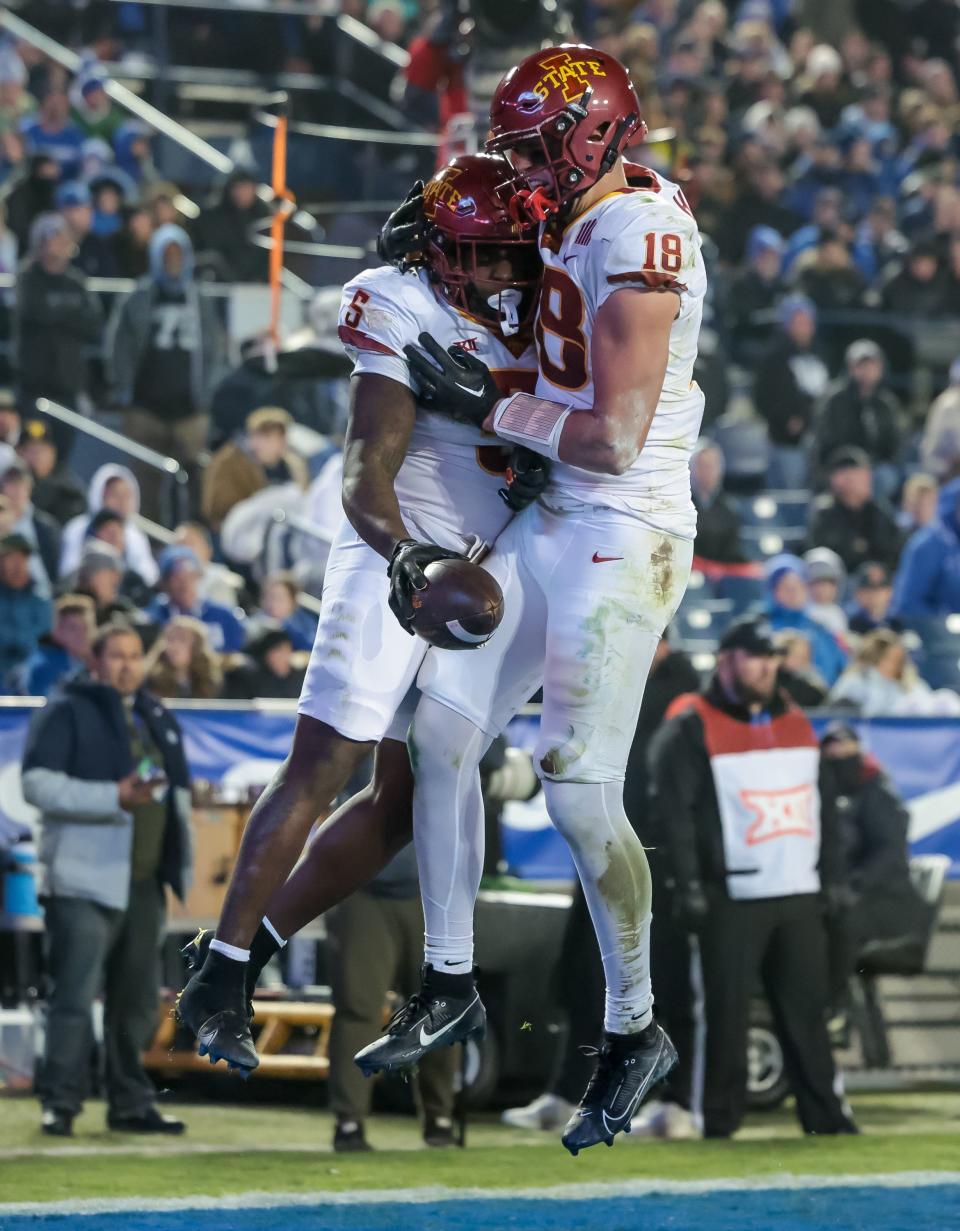 Iowa State Cyclones running back Cartevious Norton (5) and tight end Benjamin Brahmer (18) celebrate after Norton ran for a touchdown, putting the Cyclones up 24-7 after the PAT, in the game against the BYU Cougars at LaVell Edwards Stadium in Provo on Saturday, Nov. 11, 2023. | Spenser Heaps, Deseret News