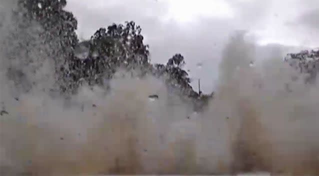 His ute crashes into the floodwaters at Sharon, outside Bundaberg. Source: Dash Cam Owners Off Road/Facebook