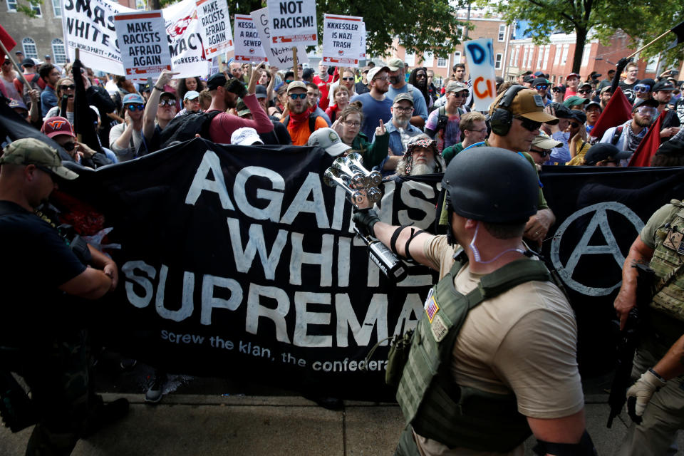 <p>Members of white nationalists are met by a group of counter-protesters in Charlottesville, Va., on Aug. 12, 2017. (Photo: Joshua Roberts/Reuters) </p>