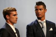 Real Madrid's Cristiano Ronaldo of Portugal (R) poses with French soccer player Antoine Griezmann after he received the Best Player UEFA 2015/16 Award during the draw ceremony for the 2016/2017 Champions League Cup soccer competition at Monaco's Grimaldi in Monaco, August 25, 2016. REUTERS/Eric Gaillard