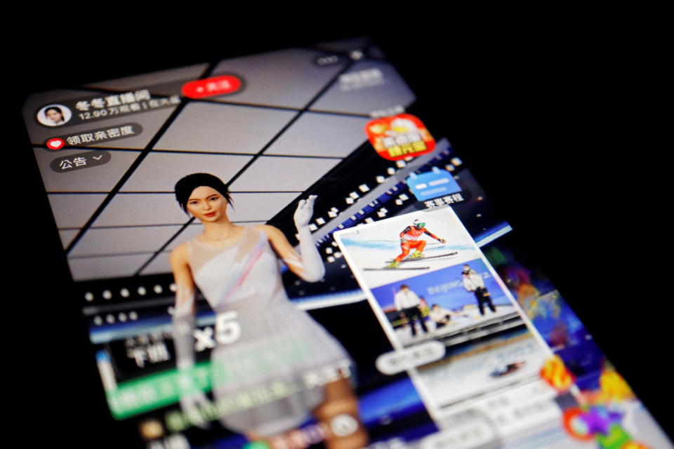 A livestreaming session by Dong Dong, a virtual idol promoting the Beijing 2022 Winter Olympics, is seen on Alibaba's e-commerce app Taobao displayed on a mobile phone in this illustration picture taken February 10, 2022. REUTERS/Florence Lo/Illustration