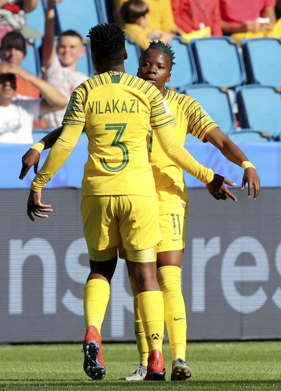 South Africa's Bambanani Mbane, left, congratulates teammate South Africa's Thembi Kgatlana after she scored the matchs first goal during the Women's World Cup Group B soccer match between Spain and South Africa at the Stade Oceane in Le Havre, France, Saturday, June 8, 2019. (AP Photo/Francisco Seco)