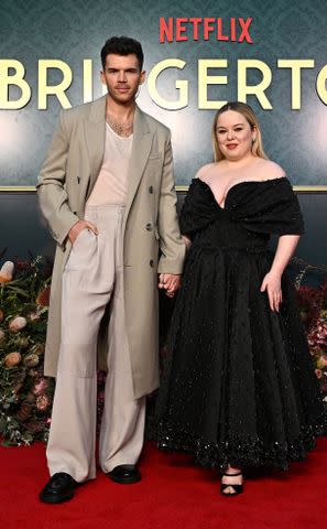 <p>James Gourley/Getty</p> Luke Newton and Nicola Coughlan attend the 'Bridgerton' season 3 launch in Australia