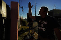 Coleman Boyd, a Mississippi physician and ardent anti-abortion activist, preaches to the patients from outside the masked iron fencing of the Jackson Women's Health Organization, a state-licensed abortion clinic in Jackson, Miss., Wednesday, Dec. 1, 2021. A small group of anti-abortion activists stood outside the clinic in an effort to dissuade patients from entering. On Wednesday, the U.S. Supreme Court hears a case that directly challenges the constitutional right to an abortion established nearly 50 years ago. (AP Photo/Rogelio V. Solis)