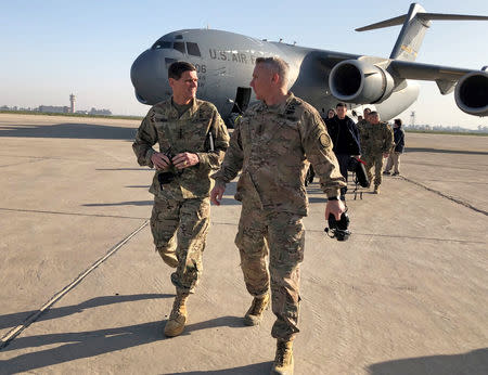 U.S. Army General Joseph Votel (L), head of the U.S. military’s Central Command, walks with U.S. Army Lieutenant General Paul LaCamera commander of the U.S.-led coalition against Islamic State, after landing in Baghdad, Iraq February 17, 2019. REUTERS/Phil Stewart