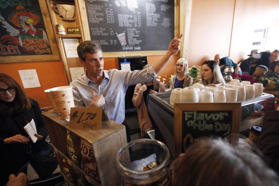 FILE - In this March 15, 2019, file photo, Democratic presidential candidate former Texas congressman Beto O'Rourke greets audience members during a stop at the Central Park Coffee Company in Mount Pleasant, Iowa. O’Rourke entered the 2020 presidential race in mid-March as a political phenomenon, addressing overflow crowds around the country in off-the-cuff ways. Now, with that buzz cooling, O'Rourke is preparing a planned "re-introduction" that will see him do more national television appearances and concentrate on producing a series of detailed policy proposals. (AP Photo/Charlie Neibergall, File)