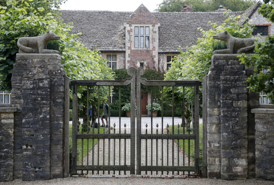 A gate protects the entrance of the Rooksnest estate near Lambourn, England, Tuesday, Aug. 6, 2019. The manor is the domain of Theresa Sackler, widow of one of Purdue Pharma’s founders and, until 2018, a member of the company’s board of directors. A complex web of companies and trusts are controlled by the family, and an examination reveals links between far-flung holdings, far removed from the opioid manufacturer’s headquarters in Stamford, Conn. (AP Photo/Frank Augstein)