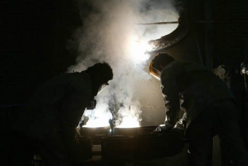 Two technicians at the zirconium production plant in southern Iran. Iranian Foreign Minister Ali Akbar Salehi has announced that long-stalled talks with world powers are to be revived on April 13 at a place yet to be agreed