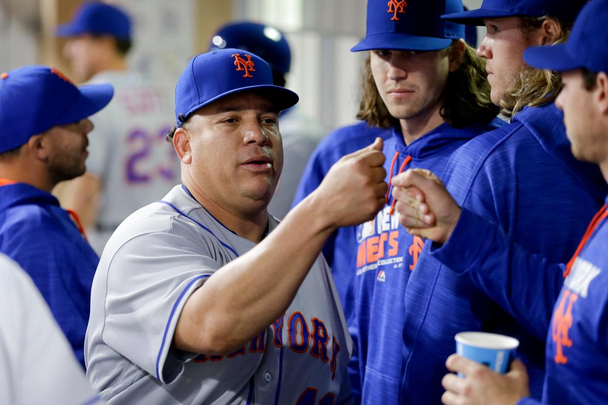 Bartolo Colon with Mets teammates during the 2016 season. Colon has signed with the Braves for this season.