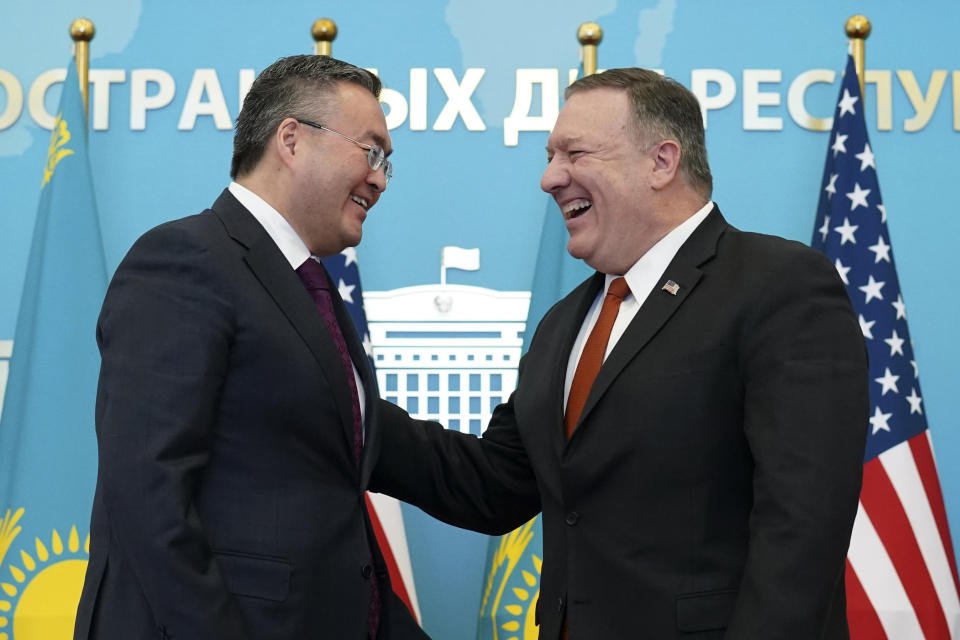 U.S. Secretary of State Mike Pompeo, right, reacts after holding a joint news conference with Kazakh Foreign Minister Mukhtar Tleuberdi at the Ministry of Foreign Affairs in Nur-Sultan, Kazakhstan, Sunday, Feb. 2, 2020. (Kevin Lamarque/Pool Photo via AP)