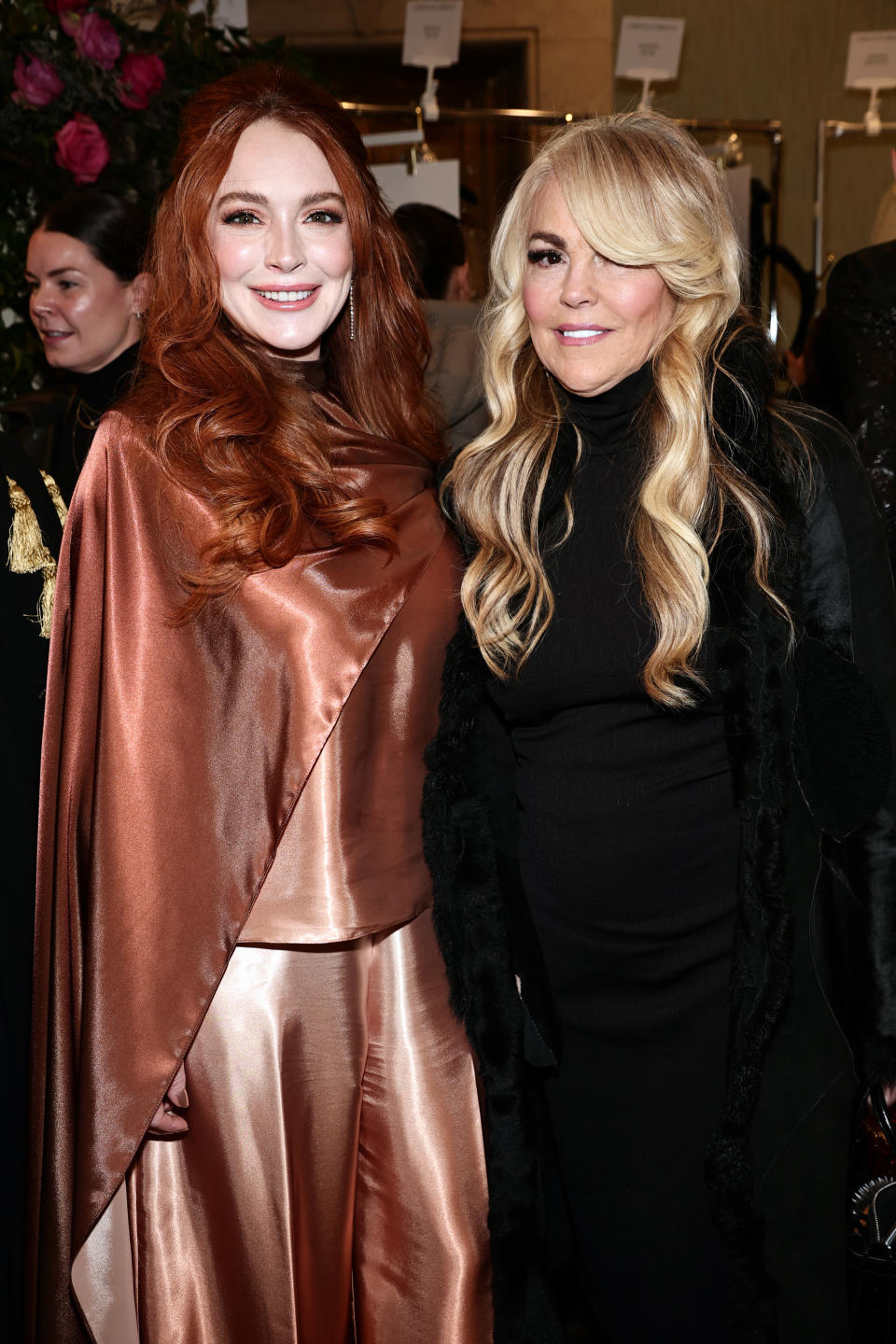 NEW YORK, NEW YORK - FEBRUARY 09: (L-R) Lindsay Lohan and Dina Lohan pose backstage at the Christian Siriano Fall/Winter 2023 NYFW Show at Gotham Hall on February 09, 2023 in New York City. (Photo by Jamie McCarthy/Getty Images for Christian Siriano)