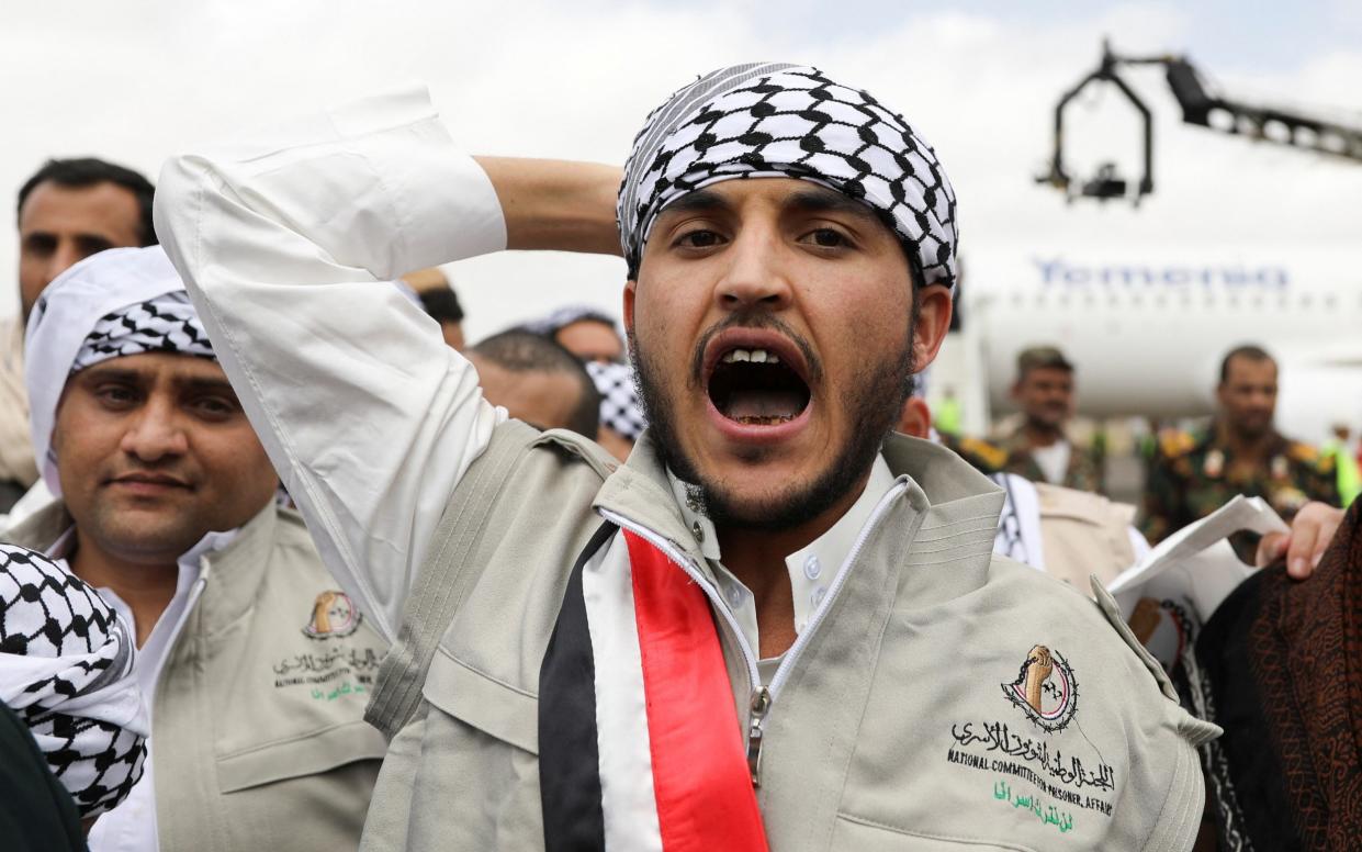 A Baraa dancer performs upon their arrival at Sanaa airport in Yemen after a prisoner swap between two sides - REUTERS