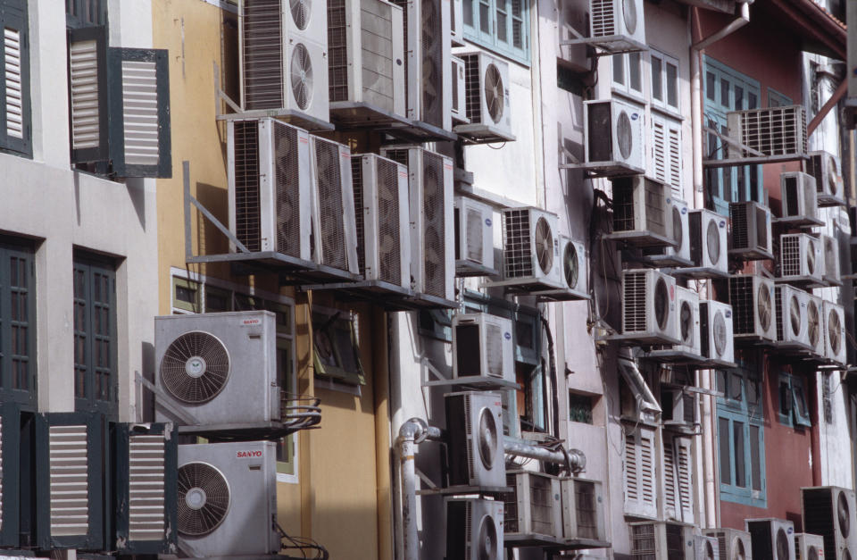 Summers in many U.S. regions can reach unearthly temperatures, and many people rely on that air conditioning system to keep them cool. You may want to reconsider: air conditioning has environmental and health impacts.  <br></br> Air conditioner use, <a href="http://environment.nationalgeographic.com/environment/green-guide/buying-guide/air-conditioner/environmental-impact/" target="_blank">says National Geographic</a>, results in 100 million tons of CO2 emissions per year… ouch. “Air-conditioners draw copious electricity, and deliver a double whammy in terms of climate change, since both the electricity they use and the coolants they contain result in planet-warming emissions,” writes Elisabeth Rosenthal <a href="http://www.nytimes.com/2012/08/19/sunday-review/air-conditioning-is-an-environmental-quandary.html" target="_blank">of the New York Times</a>. Though CFCs and HCFCs, two ozone-depleting agents, are now banned in many developed countries, developing nations can use HCFCs in air conditioners until 2040.  <br></br>  Dirty filters on air conditioners allow pesticides, allergens and other particulate matter to <a href="http://environment.nationalgeographic.com/environment/green-guide/buying-guide/air-conditioner/environmental-impact/" target="_blank">enter the home</a>, which can trigger asthma and eye, nose and throat irritation.  <br></br> <em>What you can do: <a href="http://www.theguardian.com/money/2009/jun/22/reducing-office-emissions" target="_blank">Wear lighter clothes</a> during the summer, turn the temperature up by a few degrees and invest in <a href="http://energy.gov/energysaver/articles/central-air-conditioning" target="_blank">updated and alternate technologies other than typical AC systems</a>. Lifehacker also  provides extensive <a href="http://lifehacker.com/no-central-ac-no-problem-six-ways-to-keep-your-home-c-729713655" target="_blank">tools</a> and <a href="http://lifehacker.com/5568311/five-effective-diy-alternatives-to-running-air-conditioner" target="_blank">tricks</a> for <a href="http://lifehacker.com/397054/run-ceiling-fans-counter+clockwise-for-summer-savings" target="_blank">keeping your home cool</a>. </em> <br></br> (Photo by Yvan Cohen/LightRocket via Getty Images)