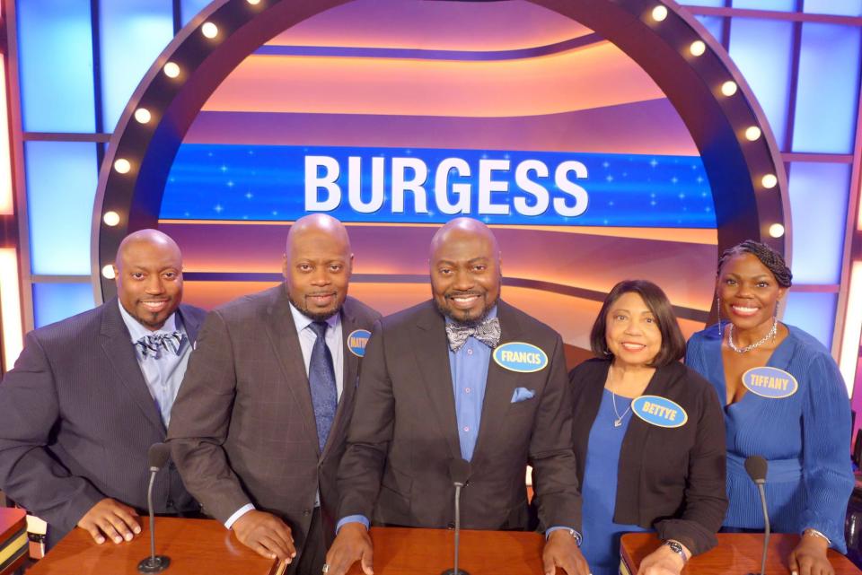 Smyrna High School biology teacher Martin Burgess, second from left, poses for a picture with his family before they appear on TV game show "Family Feud." Left to right, Burgess' brother, Matthew, Burgess, brother Francis, his mother, Bettye, and sister, Tiffany.