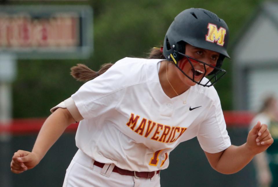 McCutcheon Mavericks Kaidynn Peckinpaugh (11) rounds the bases after hitting a home run during the IHSAA softball game against the Benton Central Bison, Tuesday, April 16, 2024, at McCutcheon High School in Lafayette, Ind.