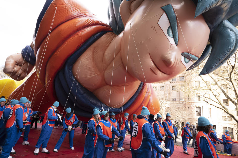 Balloon handlers hold Goku balloon close to the ground as strong winds affect the Macy's Thanksgiving Day Parade, Thursday, Nov. 28, 2019, in New York. (AP Photo/Mark Lennihan)