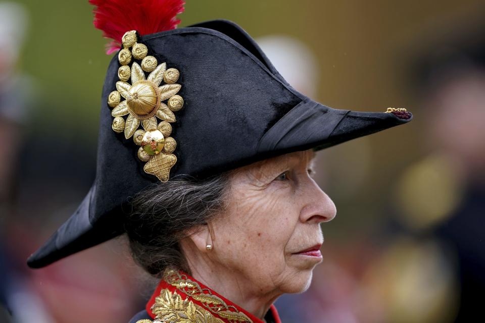 Princess Anne in the gardens of Buckingham Place as King Charles III receives a royal salute from members of the military in the gardens of Buckingham Place, London, after the coronation ceremony, Saturday, May 6, 2023. | Andrew Milligan/Pool, Associated Press