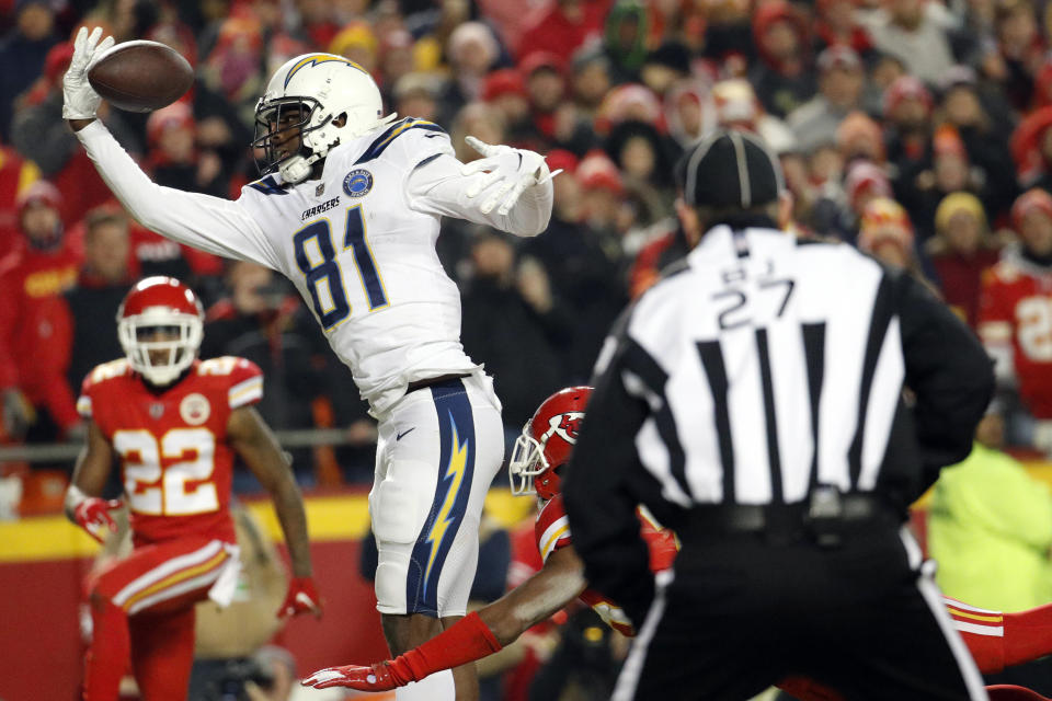 Kansas City Chiefs corner back Kendall Fuller, lower right, is called for pass interference against Los Angeles Chargers wide receiver Mike Williams (81) during the second half of an NFL football game in Kansas City, Mo., Thursday, Dec. 13, 2018. The call gave the Chargers a first-and-goal on the one-yard-line. The Los Angeles Chargers won 29-28. (AP Photo/Charlie Riedel)