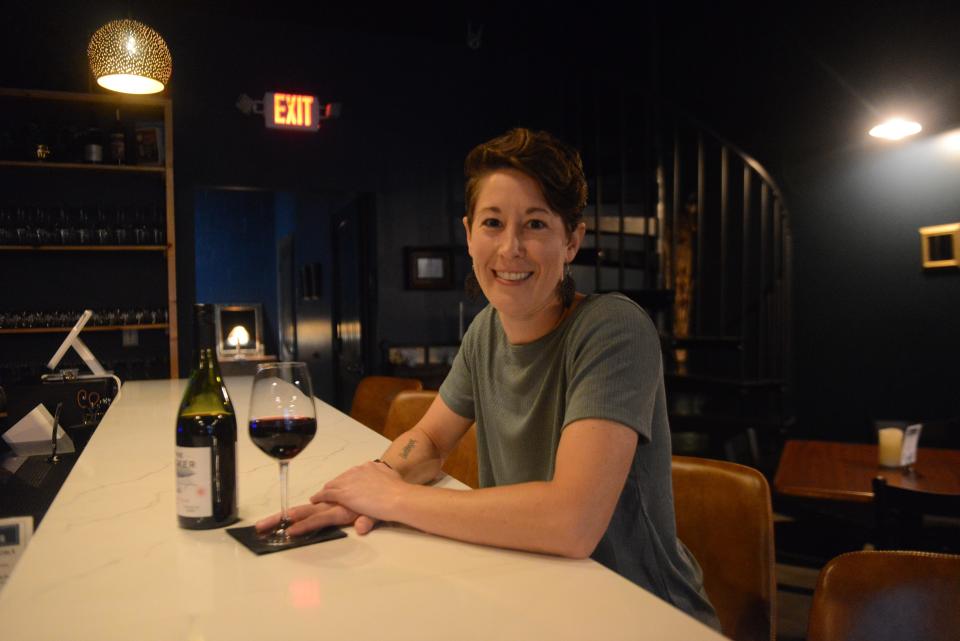 Sparrow Wine Bar co-owner Amy Burritt seated at the bar. The bar opened next to Euphoric Cheese Shop in Farragut in June. Aug. 25, 2023.