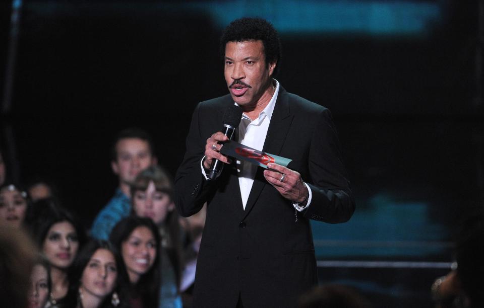 Lionel Richie speaks on stage at the iHeartRadio Music Awards at the Shrine Auditorium on Thursday, May 1, 2014, in Los Angeles. (Photo by Chris Pizzello/Invision/AP)