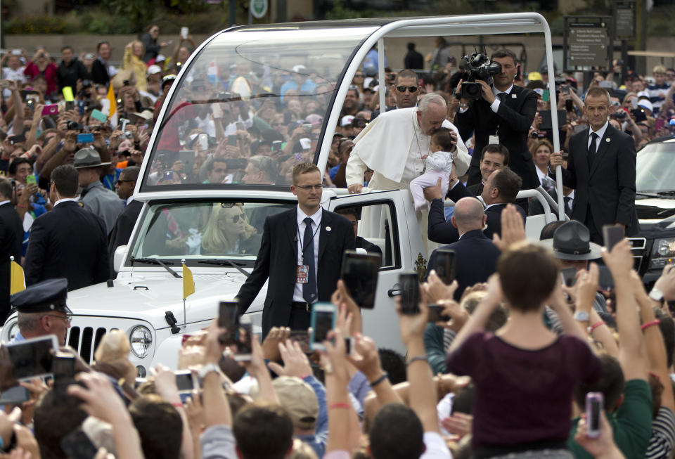 Pope Francis kisses a child during his visit to Philadelphia in 2015. (Photo: AP)