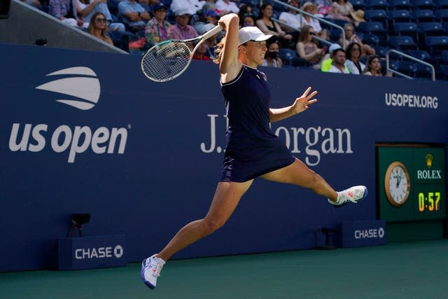 Iga Swiatek hits a forehand during her defeat by Belinda Bencic