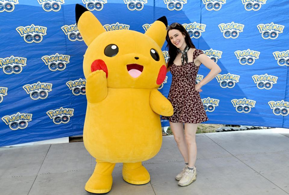 NEW YORK, NEW YORK - JULY 06: Rachel Brosnahan poses with Pikachu at Pokémon GO Fest 2024: New York City at Randall’s Island Park on July 06, 2024 in New York City. (Photo by Dave Kotinsky/Getty Images for Niantic)