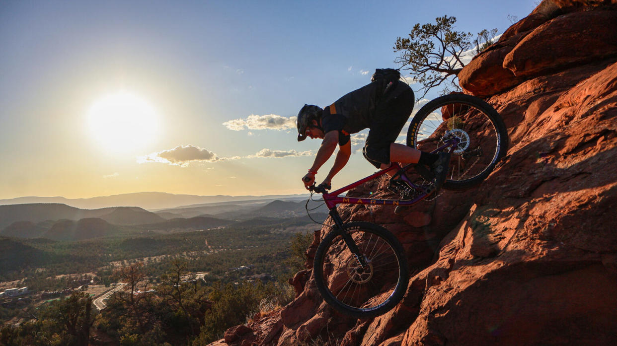 mountain biker riding MRP Ribbon LT fork down steep incline