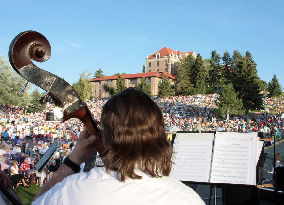 This 2009 photograph shows a musician on stage at the annual Symphony Under the Stars concert on the Carroll College lawn in Helena, Mont. The summertime event draws some 12,000 people and is one of a number of free things to do in Helena, Montana’s capital, which is located about halfway between Glacier and Yellowstone parks. This year’s concert takes place July 20. (AP Photo/Allen S. Lefohn)