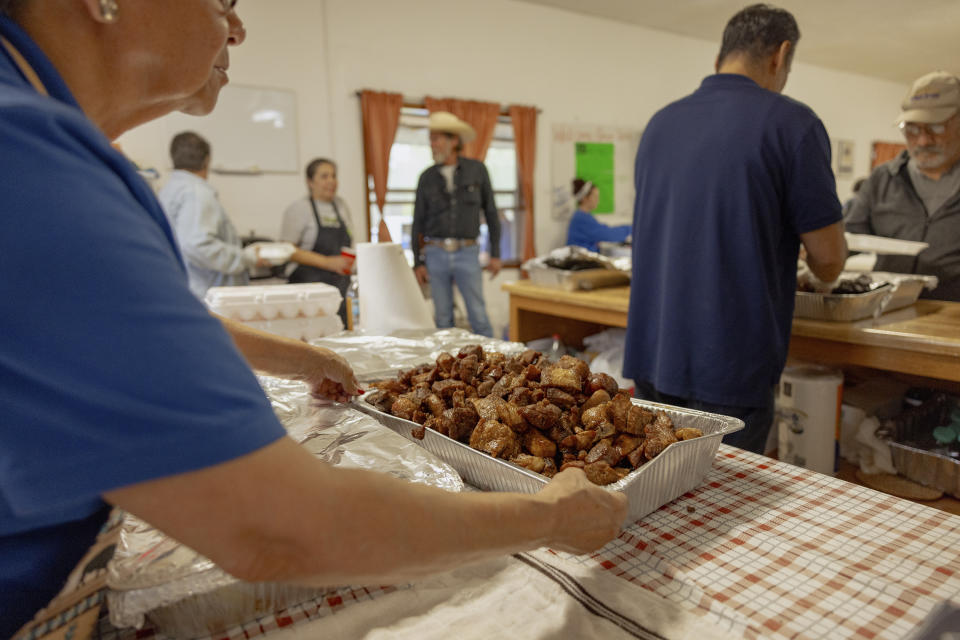 A tray of fried pork is served at the Springfield United Methodist Church's annual wild onion dinner in Okemah, Okla., on April 6, 2024. The church is on the Muscogee Nation's reservation, where the meals using wild onions picked by the community are an annual tradition. (AP Photo/Brittany Bendabout)