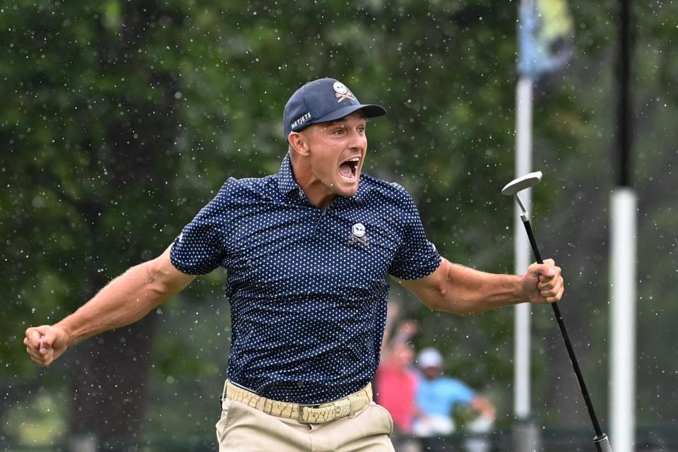 Aug 6, 2023; White Sulphur Springs, West Virginia, USA; Bryson DeChambeau celebrates after hitting a birdie putt on 18 and shooting a record 58 during the final round of the LIV Golf event at The Old White Course. Mandatory Credit: Bob Donnan-USA TODAY Sports