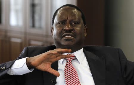 Kenya's former Prime Minister and opposition leader Raila Odinga talks during an interview with Reuters inside his office at the Capitol Hill Square in Nairobi, June 24, 2014.REUTERS/Thomas Mukoya