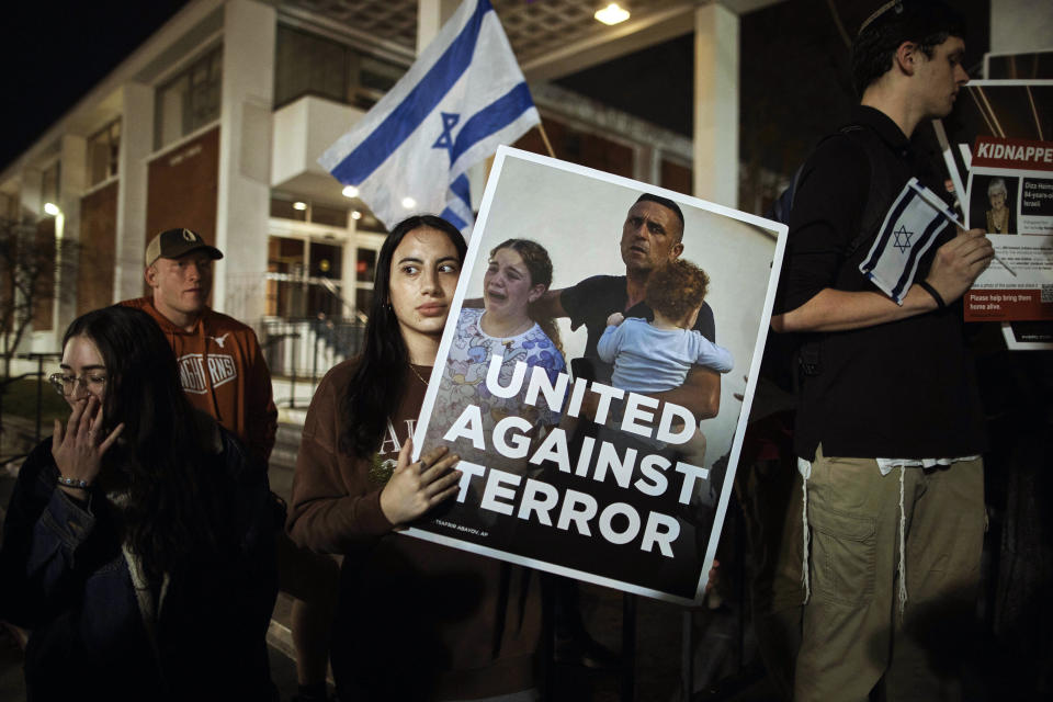 Jewish Rutgers University's students and members of the community gather holding placards to hold solidarity and vigil for Israel on Wednesday, Oct. 25, 2023, in New Brunswick, N.J. For many of the university chaplains and faith leaders caring for students angered and shaken by the Israel-Hamas war, the needs are acute, the days intense. The bloodshed has roiled campuses in the United States, sparking rival rallies and competing demands.(AP Photo/Andres Kudacki)