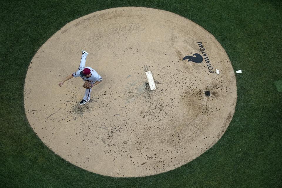 Arizona Diamondbacks starting pitcher Merrill Kelly throws during the first inning of a baseball game against the Milwaukee Brewers Monday, June 19, 2023, in Milwaukee. (AP Photo/Morry Gash)