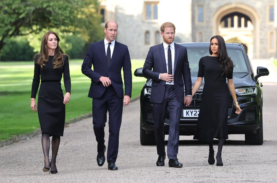 Catherine, Princess of Wales, Prince William, Prince of Wales, Prince Harry, Duke of Sussex, and Meghan, Duchess of Sussex, on the Long Walk at Windsor Castle on Sept. 10, 2022, when they greeted well-wishers at the gates of Windsor Castle ahead of the funeral for Queen Elizabeth II.