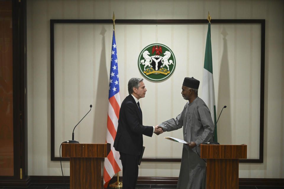 US Secretary of State Antony Blinken, left, shakes hands Nigeria's Minister of Foreign Affairs Yusuf Tuggar after a press conference at the Presidential Villa, in Abuja, Nigeria, Tuesday, Jan. 23, 2024. (Andrew Caballero-Reynolds/Pool Photo via AP)