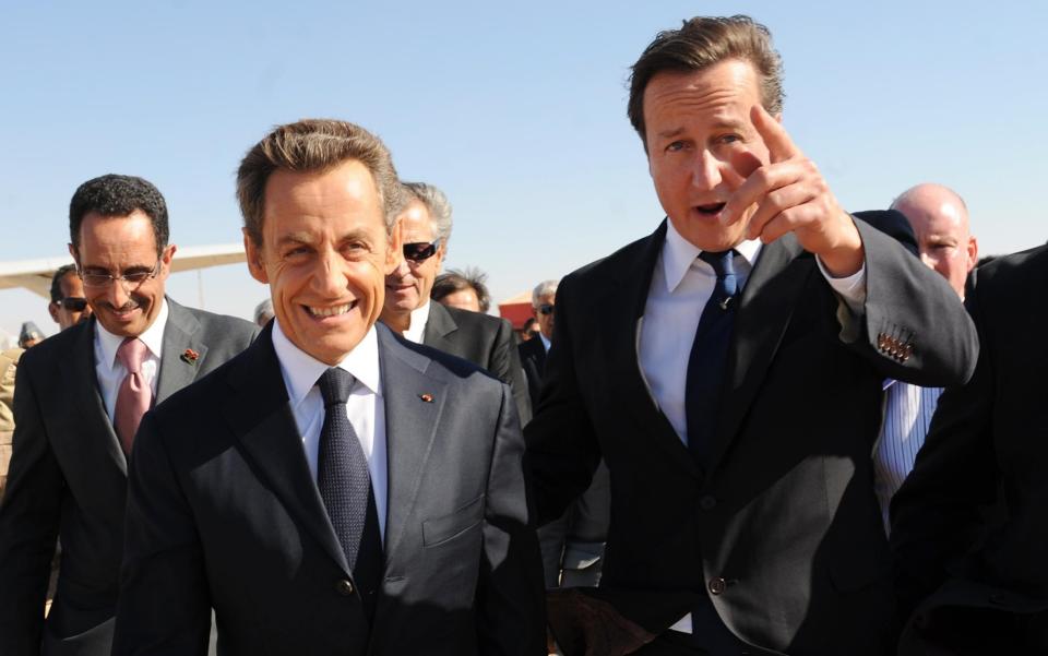 David Cameron (right) and Nicolas Sarkozy arriving at Benghazi airport in Libya in 2016 - Credit: PA