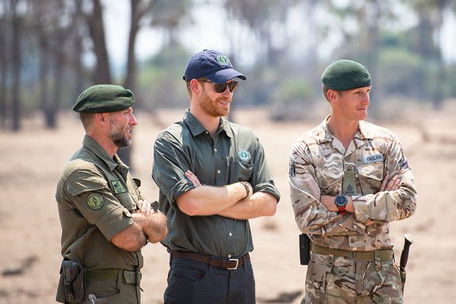 <p>Pool/Samir Hussein/WireImage</p> Prince Harry, Duke of Sussex watches an anti-poaching demonstration exercise conducted jointly by local rangers and UK military deployed on Operation CORDED at the Liwonde National Park during the royal tour of Africa on September 30, 2019