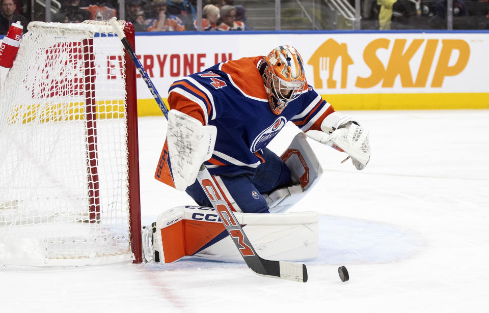 Edmonton Oilers goalie Stuart Skinner (74) makes the save against the Seattle Kraken during the first period of an NHL hockey game, Wednesday, Nov. 15, 2023 in Edmonton, Alberta. (Jason Franson/The Canadian Press via AP)