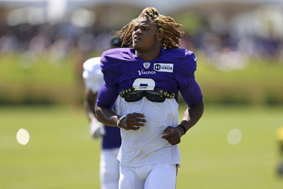 Minnesota Vikings safety Lewis Cine (6) warms up at the NFL football team's practice facility in Eagan, Minn., Friday, Aug. 5, 2022. (AP Photo/Stacy Bengs)