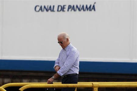 U.S. Vice President Joe Biden walks on top of the lock gates during a visit to the Miraflores Locks of the Panama Canal in Panama City November 19, 2013. REUTERS/ Carlos Jasso