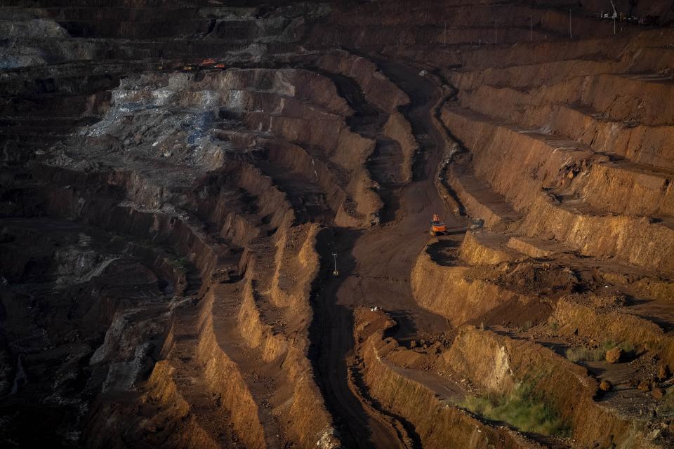 Excavators dig chromium at a mine near Kaliapani village in Jajpur district, Odisha, India Wednesday, July 5, 2023. Chromium, used mostly as a coating to stop rust in steel and car parts, has been deemed necessary for India's transition to cleaner energy. (AP Photo/Anupam Nath)